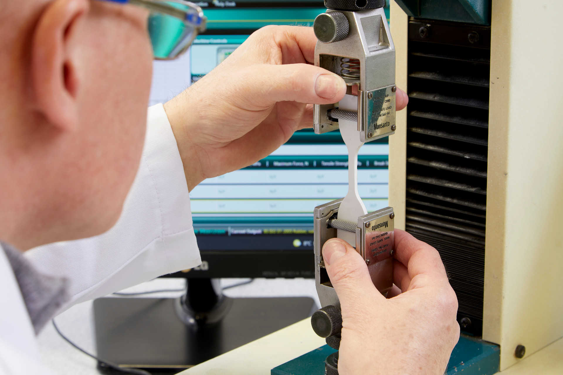 An engineer testing the strength of a hodgson sealant product.