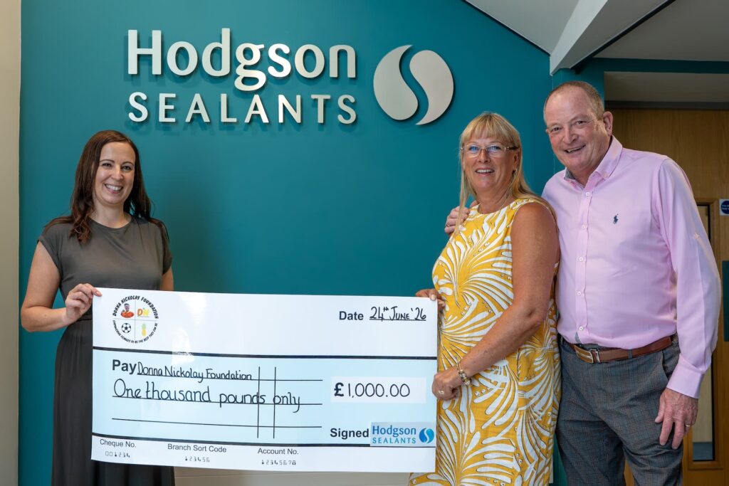 Hodgson Sealants Managing Director Danielle Houghton presents a cheque to Wendy and Mark Nickolay from the Donna Nickolay Foundation.